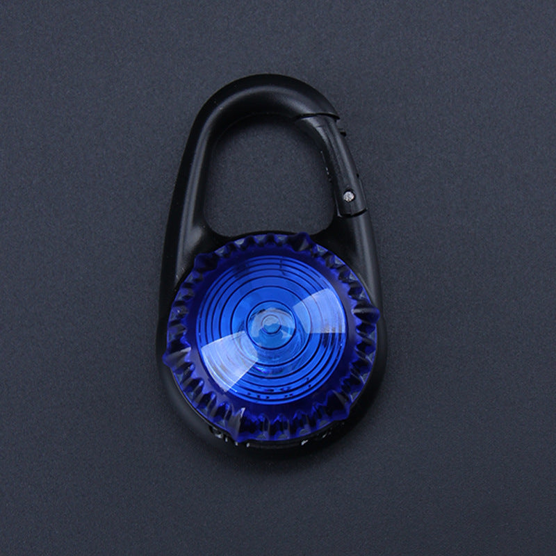 Black carabiner with a blue light on a dark gray background